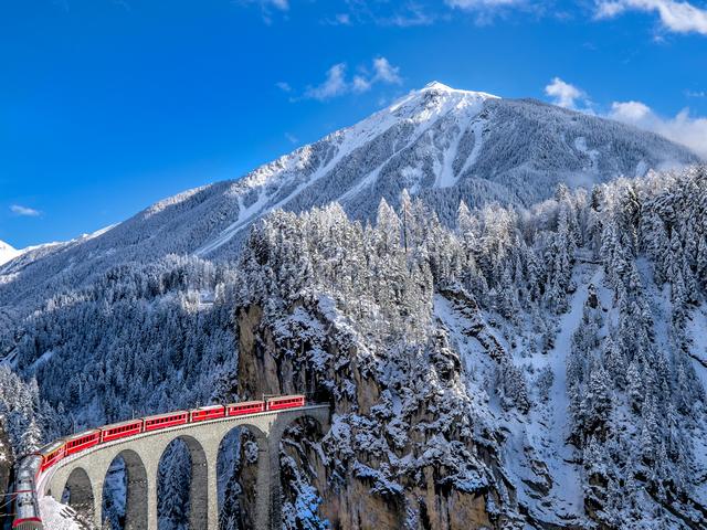 Glacier Express Switzerland-Wallpaper - Wallpaper with Glacier Express at the Landwasser Viaduct at Swiss Alps, Switzerland.<br />
The Glacier Express is a narrow-gauge train, running on schedule between Zermatt at the foot of the Matterhorn and St.Moritz, a luxury alpine ski resort in the Engadin valley in Switzerland. <br />
This train is known as the slowest express in the world, averaging a paltry 39 kph on its 8 hours meandering trip through the Alps.<br />
On this day-long journey, across almost 300km of Alpine gorgeousness, incorporating 91 tunnels and 291 bridges, passengers can enjoy widescreen panoramic views of the breathtaking scenery of Switzerland's Alps. - , Glacier, Express, Switzerland, wallpaper, wallpapers, nature, places, place, Landwasser, Viaduct, Swiss, Alps, narrow, gauge, train, trains, schedule, Zermatt, foot, Matterhorn, St.Moritz, luxury, alpine, ski, resort, Engadin, valley, train, world, trip, journey, Alpine, gorgeousness, tunnels, bridges, passengers, widescreen, panoramic, views, breathtaking, scenery - Wallpaper with Glacier Express at the Landwasser Viaduct at Swiss Alps, Switzerland.<br />
The Glacier Express is a narrow-gauge train, running on schedule between Zermatt at the foot of the Matterhorn and St.Moritz, a luxury alpine ski resort in the Engadin valley in Switzerland. <br />
This train is known as the slowest express in the world, averaging a paltry 39 kph on its 8 hours meandering trip through the Alps.<br />
On this day-long journey, across almost 300km of Alpine gorgeousness, incorporating 91 tunnels and 291 bridges, passengers can enjoy widescreen panoramic views of the breathtaking scenery of Switzerland's Alps. Resuelve rompecabezas en línea gratis Glacier Express Switzerland-Wallpaper juegos puzzle o enviar Glacier Express Switzerland-Wallpaper juego de puzzle tarjetas electrónicas de felicitación  de puzzles-games.eu.. Glacier Express Switzerland-Wallpaper puzzle, puzzles, rompecabezas juegos, puzzles-games.eu, juegos de puzzle, juegos en línea del rompecabezas, juegos gratis puzzle, juegos en línea gratis rompecabezas, Glacier Express Switzerland-Wallpaper juego de puzzle gratuito, Glacier Express Switzerland-Wallpaper juego de rompecabezas en línea, jigsaw puzzles, Glacier Express Switzerland-Wallpaper jigsaw puzzle, jigsaw puzzle games, jigsaw puzzles games, Glacier Express Switzerland-Wallpaper rompecabezas de juego tarjeta electrónica, juegos de puzzles tarjetas electrónicas, Glacier Express Switzerland-Wallpaper puzzle tarjeta electrónica de felicitación