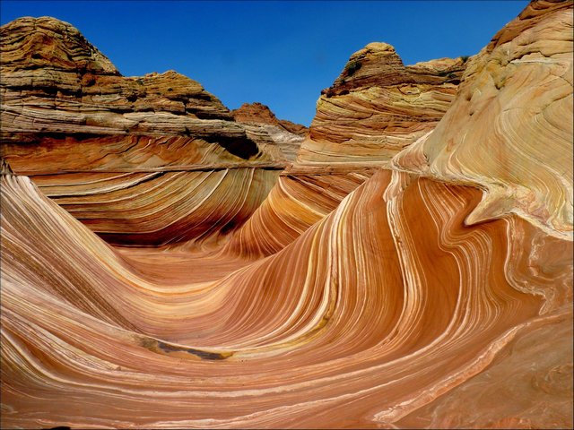 The Wave Coyote Buttes Coconino County Arizona USA - The famous amazingly beautiful colorful undulating sandstone rock formations, called 'The Wave', a small ravine which is located in Coconino County, Arizona, USA, near the border between Arizona and Utah, on the slopes of the Coyote Buttes, in the Paria Canyon, Vermilion Cliffs Wilderness, on the Colorado Plateau. The thin ridges of the U-shaped twisted troughs are created by the erosion of bedding within the Navajo Sandstone. - , Wave, waves, Coyote, Buttes, Coconino, County, Arizona, USA, nature, natures, places, place, travel, travel, tour, tours, trip, trips, famous, amazingly, beautiful, colorful, undulating, sandstone, rock, rocks, formations, formation, ravine, ravines, border, borders, Utah, slopes, slope, Paria, Canyon, canyons, Vermilion, Cliffs, Wilderness, Colorado, Plateau, ridges, ridge, erosion, Navajo - The famous amazingly beautiful colorful undulating sandstone rock formations, called 'The Wave', a small ravine which is located in Coconino County, Arizona, USA, near the border between Arizona and Utah, on the slopes of the Coyote Buttes, in the Paria Canyon, Vermilion Cliffs Wilderness, on the Colorado Plateau. The thin ridges of the U-shaped twisted troughs are created by the erosion of bedding within the Navajo Sandstone. Решайте бесплатные онлайн The Wave Coyote Buttes Coconino County Arizona USA пазлы игры или отправьте The Wave Coyote Buttes Coconino County Arizona USA пазл игру приветственную открытку  из puzzles-games.eu.. The Wave Coyote Buttes Coconino County Arizona USA пазл, пазлы, пазлы игры, puzzles-games.eu, пазл игры, онлайн пазл игры, игры пазлы бесплатно, бесплатно онлайн пазл игры, The Wave Coyote Buttes Coconino County Arizona USA бесплатно пазл игра, The Wave Coyote Buttes Coconino County Arizona USA онлайн пазл игра , jigsaw puzzles, The Wave Coyote Buttes Coconino County Arizona USA jigsaw puzzle, jigsaw puzzle games, jigsaw puzzles games, The Wave Coyote Buttes Coconino County Arizona USA пазл игра открытка, пазлы игры открытки, The Wave Coyote Buttes Coconino County Arizona USA пазл игра приветственная открытка