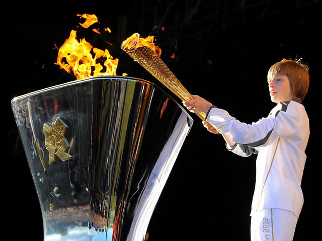 2012 Summer Olympics Torch Bearer Aaron Bell lighted Golden Cauldron in Leeds UK - The 13-year-old torch bearer Aaron Bell lighted the Golden Cauldron with the Olympic Flame on a specially erected stage at the estate of Temple Newsam in Leeds (24 June 2012) during the Olympic Torch Relay, before the opening of the Summer Olympics in London, UK. Aaron Bell from Halifax, selected by Coca-Cola for a flame carrier, is passionate about karate and has a 7th Dan Black Belt. - , 2012, Summer, Olympics, torch, torches, bearer, bearers, Aaron, Bell, golden, cauldron, cauldrons, Leeds, UK, places, place, show, shows, sport, sports, travel, travels, tour, tours, trip, trips, Olympic, flame, flames, stage, stages, estate, estates, Temple, temples, Newsam, June, London, Halifax, Coca-Cola, Coca, Cola, carrier, carriers, passionate, karate, 7th, Dan, Black, Belt, belts - The 13-year-old torch bearer Aaron Bell lighted the Golden Cauldron with the Olympic Flame on a specially erected stage at the estate of Temple Newsam in Leeds (24 June 2012) during the Olympic Torch Relay, before the opening of the Summer Olympics in London, UK. Aaron Bell from Halifax, selected by Coca-Cola for a flame carrier, is passionate about karate and has a 7th Dan Black Belt. Подреждайте безплатни онлайн 2012 Summer Olympics Torch Bearer Aaron Bell lighted Golden Cauldron in Leeds UK пъзел игри или изпратете 2012 Summer Olympics Torch Bearer Aaron Bell lighted Golden Cauldron in Leeds UK пъзел игра поздравителна картичка  от puzzles-games.eu.. 2012 Summer Olympics Torch Bearer Aaron Bell lighted Golden Cauldron in Leeds UK пъзел, пъзели, пъзели игри, puzzles-games.eu, пъзел игри, online пъзел игри, free пъзел игри, free online пъзел игри, 2012 Summer Olympics Torch Bearer Aaron Bell lighted Golden Cauldron in Leeds UK free пъзел игра, 2012 Summer Olympics Torch Bearer Aaron Bell lighted Golden Cauldron in Leeds UK online пъзел игра, jigsaw puzzles, 2012 Summer Olympics Torch Bearer Aaron Bell lighted Golden Cauldron in Leeds UK jigsaw puzzle, jigsaw puzzle games, jigsaw puzzles games, 2012 Summer Olympics Torch Bearer Aaron Bell lighted Golden Cauldron in Leeds UK пъзел игра картичка, пъзели игри картички, 2012 Summer Olympics Torch Bearer Aaron Bell lighted Golden Cauldron in Leeds UK пъзел игра поздравителна картичка