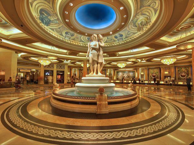 Caesars Palace Lobby Las Vegas Nevada - An impressive entrance lobby to the hotel Caesars Palace, one of luxury hotels in Las Vegas, Nevada, that is truly are fit for a king. The shining marble floors and the plenty of soft golden light, make the guests feel like in a classic ancient Roman palace. In the middle of the enormous lobby, there is a marble fountain with statue of three goddesses of the Greek and Roman mythology, known as Fates, who determined child’s destiny at birth. The theme of Rome continues on the dome ceiling and the front desk, with images of ancient chariots, horses, and gods. - , Caesars, palace, lobby, Las, Vegas, Nevada, places, place, impressive, entrance, entrances, hotel, hotels, luxury, king, kings, shining, marble, floors, floor, soft, golden, light, lights, guests, guest, classic, ancient, Roman, enormous, fountain, fountains, statue, statues, goddesses, goddess, Greek, Roman, mythology, Fates, Fate, child, destiny, birth, dome, ceiling, ceilings, desk, images, image, ancient, chariots, chariot, horses, horse, gods, good - An impressive entrance lobby to the hotel Caesars Palace, one of luxury hotels in Las Vegas, Nevada, that is truly are fit for a king. The shining marble floors and the plenty of soft golden light, make the guests feel like in a classic ancient Roman palace. In the middle of the enormous lobby, there is a marble fountain with statue of three goddesses of the Greek and Roman mythology, known as Fates, who determined child’s destiny at birth. The theme of Rome continues on the dome ceiling and the front desk, with images of ancient chariots, horses, and gods. Подреждайте безплатни онлайн Caesars Palace Lobby Las Vegas Nevada пъзел игри или изпратете Caesars Palace Lobby Las Vegas Nevada пъзел игра поздравителна картичка  от puzzles-games.eu.. Caesars Palace Lobby Las Vegas Nevada пъзел, пъзели, пъзели игри, puzzles-games.eu, пъзел игри, online пъзел игри, free пъзел игри, free online пъзел игри, Caesars Palace Lobby Las Vegas Nevada free пъзел игра, Caesars Palace Lobby Las Vegas Nevada online пъзел игра, jigsaw puzzles, Caesars Palace Lobby Las Vegas Nevada jigsaw puzzle, jigsaw puzzle games, jigsaw puzzles games, Caesars Palace Lobby Las Vegas Nevada пъзел игра картичка, пъзели игри картички, Caesars Palace Lobby Las Vegas Nevada пъзел игра поздравителна картичка