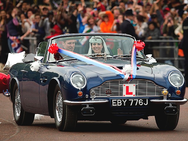 Royal Wedding England Prince William and Catherine in Aston Martin Volante driving outside Buckingham Palace London - After ceremony of the royal wedding, on April 29, 2011 in London, England, Prince William, Duke of Cambridge and his wife Catherine, Duchess of Cambridge, are driving outside the Buckingham Palace, in an open-top sports car Aston Martin DB6 MKII Volante, owned by Prince Charles since 1969. Aston Martin Volante was one of the world's great cars at its time, powered by 243-V8 engine with max power 282 hp and 286 pounds-feet torque at 5,500 rpm, top speed of 140 mph and acceleration from 0 to 60 in 7 seconds. Aston Martin DB6 with hard-top, equipped with many goodies, was a favorite car of James Bond, a hero from novels about the British spy. - , Royal, wedding, weddings, England, prince, princes, William, Catherine, Aston, Martin, Volante, Buckingham, palace, palaces, London, autos, auto, car, cars, automobiles, automobile, show, shows, celebrities, celebrity, ceremony, ceremonies, event, events, entertainment, entertainments, place, places, travel, travels, tour, tours, April, 2011, duke, dukes, Cambridge, wife, wifes, duchess, duchesses, open-top, sports, sport, DB6, MKII, Charles, 1969, world, worlds, great, 243-V8, engine, engines, power, powers, torque, torques, speed, speeds, acceleration, accelerations, hard-top, goodies, favorite, James, Bond, hero, hero, novels, novel, British, spy, spies - After ceremony of the royal wedding, on April 29, 2011 in London, England, Prince William, Duke of Cambridge and his wife Catherine, Duchess of Cambridge, are driving outside the Buckingham Palace, in an open-top sports car Aston Martin DB6 MKII Volante, owned by Prince Charles since 1969. Aston Martin Volante was one of the world's great cars at its time, powered by 243-V8 engine with max power 282 hp and 286 pounds-feet torque at 5,500 rpm, top speed of 140 mph and acceleration from 0 to 60 in 7 seconds. Aston Martin DB6 with hard-top, equipped with many goodies, was a favorite car of James Bond, a hero from novels about the British spy. Resuelve rompecabezas en línea gratis Royal Wedding England Prince William and Catherine in Aston Martin Volante driving outside Buckingham Palace London juegos puzzle o enviar Royal Wedding England Prince William and Catherine in Aston Martin Volante driving outside Buckingham Palace London juego de puzzle tarjetas electrónicas de felicitación  de puzzles-games.eu.. Royal Wedding England Prince William and Catherine in Aston Martin Volante driving outside Buckingham Palace London puzzle, puzzles, rompecabezas juegos, puzzles-games.eu, juegos de puzzle, juegos en línea del rompecabezas, juegos gratis puzzle, juegos en línea gratis rompecabezas, Royal Wedding England Prince William and Catherine in Aston Martin Volante driving outside Buckingham Palace London juego de puzzle gratuito, Royal Wedding England Prince William and Catherine in Aston Martin Volante driving outside Buckingham Palace London juego de rompecabezas en línea, jigsaw puzzles, Royal Wedding England Prince William and Catherine in Aston Martin Volante driving outside Buckingham Palace London jigsaw puzzle, jigsaw puzzle games, jigsaw puzzles games, Royal Wedding England Prince William and Catherine in Aston Martin Volante driving outside Buckingham Palace London rompecabezas de juego tarjeta electrónica, juegos de puzzles tarjetas electrónicas, Royal Wedding England Prince William and Catherine in Aston Martin Volante driving outside Buckingham Palace London puzzle tarjeta electrónica de felicitación