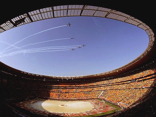 World Cup 2010 Aircraft above the Stadium - Aircraft planes fly in a formation above the impressive Soccer City stadium in Johannesburg, South Africa during the Opening ceremony of the FIFA World Cup 2010 (June 11). - , World, Cup, 2010, aircraft, aircrafts, stadium, stadiums, show, shows, performance, peformances, sport, sports, tournament, tournaments, qualification, qualifications, ceremony, ceremonies, match, matches, planes, plane, formation, formations, Soccer, City, Johannesburg, South, Africa, Opening, FIFA - Aircraft planes fly in a formation above the impressive Soccer City stadium in Johannesburg, South Africa during the Opening ceremony of the FIFA World Cup 2010 (June 11). Resuelve rompecabezas en línea gratis World Cup 2010 Aircraft above the Stadium juegos puzzle o enviar World Cup 2010 Aircraft above the Stadium juego de puzzle tarjetas electrónicas de felicitación  de puzzles-games.eu.. World Cup 2010 Aircraft above the Stadium puzzle, puzzles, rompecabezas juegos, puzzles-games.eu, juegos de puzzle, juegos en línea del rompecabezas, juegos gratis puzzle, juegos en línea gratis rompecabezas, World Cup 2010 Aircraft above the Stadium juego de puzzle gratuito, World Cup 2010 Aircraft above the Stadium juego de rompecabezas en línea, jigsaw puzzles, World Cup 2010 Aircraft above the Stadium jigsaw puzzle, jigsaw puzzle games, jigsaw puzzles games, World Cup 2010 Aircraft above the Stadium rompecabezas de juego tarjeta electrónica, juegos de puzzles tarjetas electrónicas, World Cup 2010 Aircraft above the Stadium puzzle tarjeta electrónica de felicitación