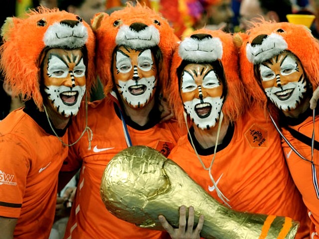 World Cup 2010 Champion Netherlands Supporters with Replica of Trophy - Netherlands supporters with faces painted as lions hold a replica of the FIFA World Cup 2010 Champion trophy before the final match between the Netherlands and Spain at the Soccer City stadium in Johannesburg, South Africa (July 11, 2010). - , World, Cup, 2010, Champion, Netherlands, supporters, supporter, replica, replicas, trophy, show, shows, sport, sports, tournament, tournaments, performance, performances, FIFA, final, match, matches, Spain, Soccer, City, stadium, stadiums, Johannesburg, South, Africa - Netherlands supporters with faces painted as lions hold a replica of the FIFA World Cup 2010 Champion trophy before the final match between the Netherlands and Spain at the Soccer City stadium in Johannesburg, South Africa (July 11, 2010). Решайте бесплатные онлайн World Cup 2010 Champion Netherlands Supporters with Replica of Trophy пазлы игры или отправьте World Cup 2010 Champion Netherlands Supporters with Replica of Trophy пазл игру приветственную открытку  из puzzles-games.eu.. World Cup 2010 Champion Netherlands Supporters with Replica of Trophy пазл, пазлы, пазлы игры, puzzles-games.eu, пазл игры, онлайн пазл игры, игры пазлы бесплатно, бесплатно онлайн пазл игры, World Cup 2010 Champion Netherlands Supporters with Replica of Trophy бесплатно пазл игра, World Cup 2010 Champion Netherlands Supporters with Replica of Trophy онлайн пазл игра , jigsaw puzzles, World Cup 2010 Champion Netherlands Supporters with Replica of Trophy jigsaw puzzle, jigsaw puzzle games, jigsaw puzzles games, World Cup 2010 Champion Netherlands Supporters with Replica of Trophy пазл игра открытка, пазлы игры открытки, World Cup 2010 Champion Netherlands Supporters with Replica of Trophy пазл игра приветственная открытка