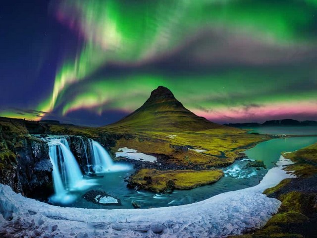 Aurora Borealis over Mt. Kirkjufell in Iceland - A breathtaking aurora borealis over Mt. Kirkjufell in Iceland, with striking lights in vibrant colors, which are stunning dancing in the skies.<br />
The northern lights, also known as the aurora borealis, are the visible result of solar particles entering the Earth’s magnetic field and ionizing high in the atmosphere, which gives them their colors, usually green, but occasionally purple, red, pink, orange and blue.<br />
The auroras only appear near the Earth’s magnetic poles.They’re usually visible above a latitude of 60 degrees north and below 60 degrees south (the 'southern lights' are called the Aurora Australis). Iceland sits at a latitude of approximately 64 degrees north, making it the perfect place to see the northern lights. - , Aurora, Borealis, Mt., Kirkjufell, Iceland, nature, natures, places, place, breathtaking, striking, lights, vibrant, colors, stunning, skies, sky, northern, result, solar, particles, Earth, magnetic, field, atmosphere, green, purple, red, pink, orange, blue, magnetic, poles, latitude, north, south, southern, australis, place - A breathtaking aurora borealis over Mt. Kirkjufell in Iceland, with striking lights in vibrant colors, which are stunning dancing in the skies.<br />
The northern lights, also known as the aurora borealis, are the visible result of solar particles entering the Earth’s magnetic field and ionizing high in the atmosphere, which gives them their colors, usually green, but occasionally purple, red, pink, orange and blue.<br />
The auroras only appear near the Earth’s magnetic poles.They’re usually visible above a latitude of 60 degrees north and below 60 degrees south (the 'southern lights' are called the Aurora Australis). Iceland sits at a latitude of approximately 64 degrees north, making it the perfect place to see the northern lights. Solve free online Aurora Borealis over Mt. Kirkjufell in Iceland puzzle games or send Aurora Borealis over Mt. Kirkjufell in Iceland puzzle game greeting ecards  from puzzles-games.eu.. Aurora Borealis over Mt. Kirkjufell in Iceland puzzle, puzzles, puzzles games, puzzles-games.eu, puzzle games, online puzzle games, free puzzle games, free online puzzle games, Aurora Borealis over Mt. Kirkjufell in Iceland free puzzle game, Aurora Borealis over Mt. Kirkjufell in Iceland online puzzle game, jigsaw puzzles, Aurora Borealis over Mt. Kirkjufell in Iceland jigsaw puzzle, jigsaw puzzle games, jigsaw puzzles games, Aurora Borealis over Mt. Kirkjufell in Iceland puzzle game ecard, puzzles games ecards, Aurora Borealis over Mt. Kirkjufell in Iceland puzzle game greeting ecard