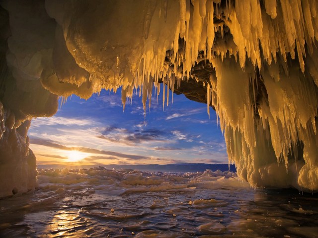 Baikal Ice Cave Landscape Russia - Beautiful landscape with sunset, viewed through sparkling stalactites from inside an ice cave on Olkhon Island in Lake Baikal, Russia. <br />
The lake Baikal is located in the south of the Russian region of Siberia, between Irkutsk Oblast and the Buryat Republic, near the Mongolian border. It is the oldest (at 25 million years), deepest (with a maximum depth of 1,642 m) and clearest freshwater lake in the world. The lake Baikal, with its 23,615.39 km3, is the most voluminous freshwater lake, containing roughly 20% of the world's unfrozen fresh water.<br />
In winter, the lake Baikal is transformеd to the realm of the great ice and mighty winds, which lead to fascinating phenomena building beautiful and incredible ice formations. - , Baikal, ice, cave, caves, landscape, landscapes, Russia, naure, natures, sunset, stalactite, stalactite, cave, caves, Olkhon, island, lake, lakes, Russian, region, regions, Siberia, Irkutsk, oblast, Buryat, republic, republics, Mongolian, border, borders, freshwater, freshwaters, unfrozen, fresh, water, winter, realm, ice, ices, mighty, winds, wind, which, lead, to, fascinating, phenomena, incredible, formations, formation - Beautiful landscape with sunset, viewed through sparkling stalactites from inside an ice cave on Olkhon Island in Lake Baikal, Russia. <br />
The lake Baikal is located in the south of the Russian region of Siberia, between Irkutsk Oblast and the Buryat Republic, near the Mongolian border. It is the oldest (at 25 million years), deepest (with a maximum depth of 1,642 m) and clearest freshwater lake in the world. The lake Baikal, with its 23,615.39 km3, is the most voluminous freshwater lake, containing roughly 20% of the world's unfrozen fresh water.<br />
In winter, the lake Baikal is transformеd to the realm of the great ice and mighty winds, which lead to fascinating phenomena building beautiful and incredible ice formations. Solve free online Baikal Ice Cave Landscape Russia puzzle games or send Baikal Ice Cave Landscape Russia puzzle game greeting ecards  from puzzles-games.eu.. Baikal Ice Cave Landscape Russia puzzle, puzzles, puzzles games, puzzles-games.eu, puzzle games, online puzzle games, free puzzle games, free online puzzle games, Baikal Ice Cave Landscape Russia free puzzle game, Baikal Ice Cave Landscape Russia online puzzle game, jigsaw puzzles, Baikal Ice Cave Landscape Russia jigsaw puzzle, jigsaw puzzle games, jigsaw puzzles games, Baikal Ice Cave Landscape Russia puzzle game ecard, puzzles games ecards, Baikal Ice Cave Landscape Russia puzzle game greeting ecard