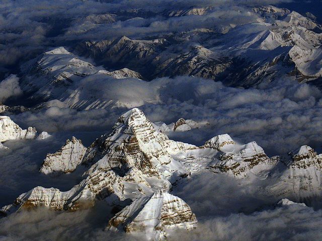 Mount Assiniboine Matterhorn of Canada in North America - A view on Mount Assiniboine, during a flight from Vancouver to Calgary and Mt Assiniboine, which is the highest peak in the Southern Continental Ranges of the Canadian Rockies with its 3,618 m (11,870 ft). Due to its pyramidal shape, the high winds, freezing temperatures and a dangerous challenge for mountaineers, Mount Assiniboine has been called the 'Matterhorn' of Canada in North America. - , Mount, mountain, mountains, Assiniboine, Matterhorn, Canada, North, America, nature, natures, place, places, travel, travels, tour, tours, trip, trips, flight, flights, Vancouver, Calgary, Mt, Mt., highest, peak, peaks, Southern, Continental, Ranges, range, Canadian, Rockies, Rocky, 3, 618m, 11, 870ft, pyramidal, shape, shapes, winds, wind, freezing, temperatures, temperature, dangerous, challenge, challenges, mountaineers, mountaineer - A view on Mount Assiniboine, during a flight from Vancouver to Calgary and Mt Assiniboine, which is the highest peak in the Southern Continental Ranges of the Canadian Rockies with its 3,618 m (11,870 ft). Due to its pyramidal shape, the high winds, freezing temperatures and a dangerous challenge for mountaineers, Mount Assiniboine has been called the 'Matterhorn' of Canada in North America. Solve free online Mount Assiniboine Matterhorn of Canada in North America puzzle games or send Mount Assiniboine Matterhorn of Canada in North America puzzle game greeting ecards  from puzzles-games.eu.. Mount Assiniboine Matterhorn of Canada in North America puzzle, puzzles, puzzles games, puzzles-games.eu, puzzle games, online puzzle games, free puzzle games, free online puzzle games, Mount Assiniboine Matterhorn of Canada in North America free puzzle game, Mount Assiniboine Matterhorn of Canada in North America online puzzle game, jigsaw puzzles, Mount Assiniboine Matterhorn of Canada in North America jigsaw puzzle, jigsaw puzzle games, jigsaw puzzles games, Mount Assiniboine Matterhorn of Canada in North America puzzle game ecard, puzzles games ecards, Mount Assiniboine Matterhorn of Canada in North America puzzle game greeting ecard