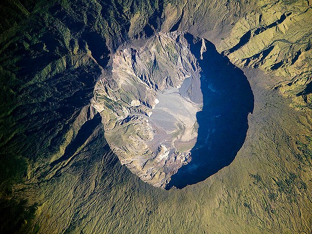 Volcano Indonesia Mount Tambora the Crater Ridge - The crater's ridge of  volcano on Mount Tambora at Sumbawa island, Indonesia, whose eruption on April 10, 1815 caused a global cooling and climate anomaly as 'Volcanic winter' on North American and Europe and since then 1816 became known as the 'Year without Summer'. - , volcano, volcanoes, Indonesia, Mount, Tambora, crater, craters, ridge, ridges, nature, natures, Sumbawa, island, islands, eruption, eruptions, April, 1815, global, cooling, coolings, climate, anomaly, anomalies, volcanic, winter, winters, North, America, and, Europe, 1816, known, year, years, without, summer, summers - The crater's ridge of  volcano on Mount Tambora at Sumbawa island, Indonesia, whose eruption on April 10, 1815 caused a global cooling and climate anomaly as 'Volcanic winter' on North American and Europe and since then 1816 became known as the 'Year without Summer'. Solve free online Volcano Indonesia Mount Tambora the Crater Ridge puzzle games or send Volcano Indonesia Mount Tambora the Crater Ridge puzzle game greeting ecards  from puzzles-games.eu.. Volcano Indonesia Mount Tambora the Crater Ridge puzzle, puzzles, puzzles games, puzzles-games.eu, puzzle games, online puzzle games, free puzzle games, free online puzzle games, Volcano Indonesia Mount Tambora the Crater Ridge free puzzle game, Volcano Indonesia Mount Tambora the Crater Ridge online puzzle game, jigsaw puzzles, Volcano Indonesia Mount Tambora the Crater Ridge jigsaw puzzle, jigsaw puzzle games, jigsaw puzzles games, Volcano Indonesia Mount Tambora the Crater Ridge puzzle game ecard, puzzles games ecards, Volcano Indonesia Mount Tambora the Crater Ridge puzzle game greeting ecard