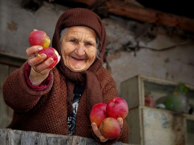 Hospitality in Rhodope Mountains Bulgaria - Beautiful photo of an old, wrinkled woman with a charming toothless smile, who offers generously apples and hospitality among an unique and memorable with serenity scenery of the Rhodope Mountains in Bulgaria. - , hospitality, Rhodope, Mountains, mountain, Bulgaria, places, place, nature, natures, travel, tour, beautiful, photo, photos, old, wrinkled, woman, women, charming, toothless, smile, smiles, generously, apples, apple, unique, memorable, serenity, scenery, sceneries - Beautiful photo of an old, wrinkled woman with a charming toothless smile, who offers generously apples and hospitality among an unique and memorable with serenity scenery of the Rhodope Mountains in Bulgaria. Решайте бесплатные онлайн Hospitality in Rhodope Mountains Bulgaria пазлы игры или отправьте Hospitality in Rhodope Mountains Bulgaria пазл игру приветственную открытку  из puzzles-games.eu.. Hospitality in Rhodope Mountains Bulgaria пазл, пазлы, пазлы игры, puzzles-games.eu, пазл игры, онлайн пазл игры, игры пазлы бесплатно, бесплатно онлайн пазл игры, Hospitality in Rhodope Mountains Bulgaria бесплатно пазл игра, Hospitality in Rhodope Mountains Bulgaria онлайн пазл игра , jigsaw puzzles, Hospitality in Rhodope Mountains Bulgaria jigsaw puzzle, jigsaw puzzle games, jigsaw puzzles games, Hospitality in Rhodope Mountains Bulgaria пазл игра открытка, пазлы игры открытки, Hospitality in Rhodope Mountains Bulgaria пазл игра приветственная открытка