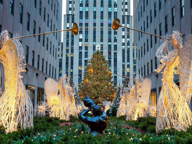 Rockefeller Christmas Tree in New York City - The Christmas tree and the triumphant herald angels that are the centerpiece of the annual Christmas display in the Channel Gardens of Rockefeller Center is a world-wide symbol of the holidays in New York City. <br />
The 12 wire angel figures, each holding a 6-foot-long trumpet, that heralds the holiday season, were created by the American artist of British birth Valerie Clarebout in 1955. - , Rockefeller, Christmas, tree, trees, New, York, City, places, place, holiday, holidays, triumphant, herald, angels, angel, centerpiece, annual, display, Channel, Gardens, Center, symbol, wire, angel, figures, trumpet, season, American, artist, British, birth, Valerie, Clarebout, 1955 - The Christmas tree and the triumphant herald angels that are the centerpiece of the annual Christmas display in the Channel Gardens of Rockefeller Center is a world-wide symbol of the holidays in New York City. <br />
The 12 wire angel figures, each holding a 6-foot-long trumpet, that heralds the holiday season, were created by the American artist of British birth Valerie Clarebout in 1955. Solve free online Rockefeller Christmas Tree in New York City puzzle games or send Rockefeller Christmas Tree in New York City puzzle game greeting ecards  from puzzles-games.eu.. Rockefeller Christmas Tree in New York City puzzle, puzzles, puzzles games, puzzles-games.eu, puzzle games, online puzzle games, free puzzle games, free online puzzle games, Rockefeller Christmas Tree in New York City free puzzle game, Rockefeller Christmas Tree in New York City online puzzle game, jigsaw puzzles, Rockefeller Christmas Tree in New York City jigsaw puzzle, jigsaw puzzle games, jigsaw puzzles games, Rockefeller Christmas Tree in New York City puzzle game ecard, puzzles games ecards, Rockefeller Christmas Tree in New York City puzzle game greeting ecard
