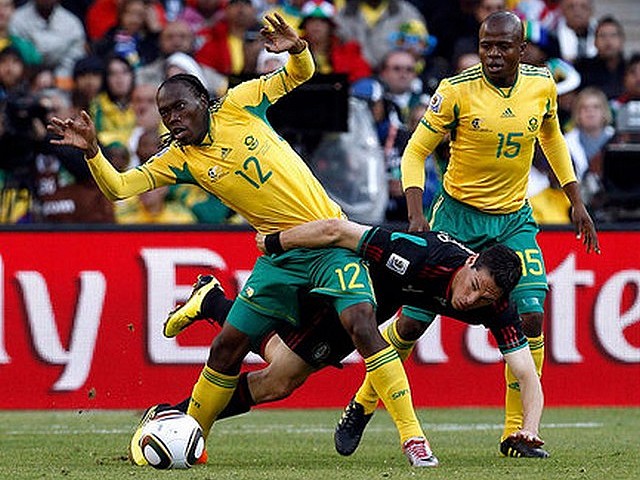 World Cup 2010 the Opening Match - Reneilwe Letsholonyane and Steven Pienaar from South Afica and Mexico's Guillermo Franco in the Opening Match of the FIFA World Cup 2010 at the Soccer City stadium in Johannesburg (June 11). - , World, Cup, 2010, Opening, match, matches, sport, sports, tournament, tournaments, qualification, qualifications, Reneilwe, Letsholonyane, Steven, Pienaar, Guillermo, Franco, Opening, South, Africa, Mexico, FIFA, Soccer, City, stadium, stadiums, Johannesburg - Reneilwe Letsholonyane and Steven Pienaar from South Afica and Mexico's Guillermo Franco in the Opening Match of the FIFA World Cup 2010 at the Soccer City stadium in Johannesburg (June 11). Solve free online World Cup 2010 the Opening Match puzzle games or send World Cup 2010 the Opening Match puzzle game greeting ecards  from puzzles-games.eu.. World Cup 2010 the Opening Match puzzle, puzzles, puzzles games, puzzles-games.eu, puzzle games, online puzzle games, free puzzle games, free online puzzle games, World Cup 2010 the Opening Match free puzzle game, World Cup 2010 the Opening Match online puzzle game, jigsaw puzzles, World Cup 2010 the Opening Match jigsaw puzzle, jigsaw puzzle games, jigsaw puzzles games, World Cup 2010 the Opening Match puzzle game ecard, puzzles games ecards, World Cup 2010 the Opening Match puzzle game greeting ecard