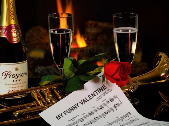 Valentines Day Romantic Music and Wine Wallpaper - Wallpaper for Valentines Day, depicting a musical score of 'My Funny Valentine' and bottle of Prosecco DOC Spumante, on background of burning fireplace, for the lovers of romantic music and an Italian white wine. <br />
Prosecco DOC Spumante is a popular sparkling wine, made from Glera grapes, using the Charmat-Martinotti method, in which the secondary fermentation takes place in stainless steel tanks, making the wine a less expensive substitute for the Champagne.<br />
'My Funny Valentine' is a show tune from the 1937, by the American composer Richard Rodgers (1902-1979) and the lyricists Lorenz Hart (1895-1943) and Oscar Hammerstein II, which became a popular classic jazz standard , appearing on over 1300 albums, recorded by over 600 performers, as  Frank Sinatra (1954), Chet Baker (1955), Ella Fitzgerald (1956), Miles Davis (1964), Chris Botti (2003). - , Valentines, Day, romantic, music, wine, wallpaper, wallpapers, cartoon, cartoons, holiday, holidays, feast, musical, score, scores, funny, Valentine, bottle, bottles, Prosecco, Spumante, background, backgrounds, fireplace, fireplaces, lovers, lover, Italian, white, popular, sparkling, Glera, grapes, grape, Charmat, Martinotti, method, methods, fermentation, stainless, steel, tanks, tank, expensive, substitute, Champagne, show, tune, tunes, 1937, American, composer, composers, Richard, Rodgers, 1902, 1979, lyricists, lyricist, Lorenz, Hart, 1895, 1943, Oscar, Hammerstein, popular, classic, jazz, standard, albums, album, performers, performer, Frank, Sinatra, 1954, Chet, Baker, 1955, Ella, Fitzgerald, 1956, Miles, Davis, 1964, Chris, Botti, 2003 - Wallpaper for Valentines Day, depicting a musical score of 'My Funny Valentine' and bottle of Prosecco DOC Spumante, on background of burning fireplace, for the lovers of romantic music and an Italian white wine. <br />
Prosecco DOC Spumante is a popular sparkling wine, made from Glera grapes, using the Charmat-Martinotti method, in which the secondary fermentation takes place in stainless steel tanks, making the wine a less expensive substitute for the Champagne.<br />
'My Funny Valentine' is a show tune from the 1937, by the American composer Richard Rodgers (1902-1979) and the lyricists Lorenz Hart (1895-1943) and Oscar Hammerstein II, which became a popular classic jazz standard , appearing on over 1300 albums, recorded by over 600 performers, as  Frank Sinatra (1954), Chet Baker (1955), Ella Fitzgerald (1956), Miles Davis (1964), Chris Botti (2003). Solve free online Valentines Day Romantic Music and Wine Wallpaper puzzle games or send Valentines Day Romantic Music and Wine Wallpaper puzzle game greeting ecards  from puzzles-games.eu.. Valentines Day Romantic Music and Wine Wallpaper puzzle, puzzles, puzzles games, puzzles-games.eu, puzzle games, online puzzle games, free puzzle games, free online puzzle games, Valentines Day Romantic Music and Wine Wallpaper free puzzle game, Valentines Day Romantic Music and Wine Wallpaper online puzzle game, jigsaw puzzles, Valentines Day Romantic Music and Wine Wallpaper jigsaw puzzle, jigsaw puzzle games, jigsaw puzzles games, Valentines Day Romantic Music and Wine Wallpaper puzzle game ecard, puzzles games ecards, Valentines Day Romantic Music and Wine Wallpaper puzzle game greeting ecard
