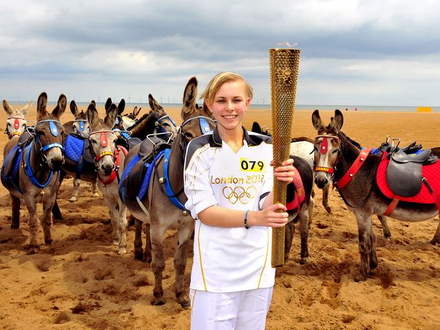 2012 London Olympics Torchbearer Starr Halley with Olympic Flame in Skegness England - Starr Halley, a 15-year-old student in King Edward VI Humanities College in Spilsby, with Olympic Flame in Skegness, England, a seaside town and resort in East Lindsey, on Lincolnshire coast of the North Sea (June 27, 2012) . She is one of 8,000 torchbearers in Torch Relay, which continued 70 days, traveled 8,000 miles and marked the start of the London Olympics. Starr Halley was diagnosed with a malignant brain tumour in 2009 and underwent a surgery and treatment. - , 2012, London, Olympics, torchbearer, torchbearers, Starr, Halley, Olympic, flame, flames, Skegness, England, show, shows, sport, sports, places, place, travel, travels, tour, tours, trip, trips, student, students, King, Edward, Humanities, college, colleges, Spilsby, seaside, town, towns, resort, resorts, East, Lindsey, Lincolnshire, North, Sea, June, torch, torches, relay, relays, days, day, miles, mile, start, stars, malignant, brain, brains, tumour, tumors, 2009, surgery, surgeries, treatment, treatments - Starr Halley, a 15-year-old student in King Edward VI Humanities College in Spilsby, with Olympic Flame in Skegness, England, a seaside town and resort in East Lindsey, on Lincolnshire coast of the North Sea (June 27, 2012) . She is one of 8,000 torchbearers in Torch Relay, which continued 70 days, traveled 8,000 miles and marked the start of the London Olympics. Starr Halley was diagnosed with a malignant brain tumour in 2009 and underwent a surgery and treatment. Solve free online 2012 London Olympics Torchbearer Starr Halley with Olympic Flame in Skegness England puzzle games or send 2012 London Olympics Torchbearer Starr Halley with Olympic Flame in Skegness England puzzle game greeting ecards  from puzzles-games.eu.. 2012 London Olympics Torchbearer Starr Halley with Olympic Flame in Skegness England puzzle, puzzles, puzzles games, puzzles-games.eu, puzzle games, online puzzle games, free puzzle games, free online puzzle games, 2012 London Olympics Torchbearer Starr Halley with Olympic Flame in Skegness England free puzzle game, 2012 London Olympics Torchbearer Starr Halley with Olympic Flame in Skegness England online puzzle game, jigsaw puzzles, 2012 London Olympics Torchbearer Starr Halley with Olympic Flame in Skegness England jigsaw puzzle, jigsaw puzzle games, jigsaw puzzles games, 2012 London Olympics Torchbearer Starr Halley with Olympic Flame in Skegness England puzzle game ecard, puzzles games ecards, 2012 London Olympics Torchbearer Starr Halley with Olympic Flame in Skegness England puzzle game greeting ecard