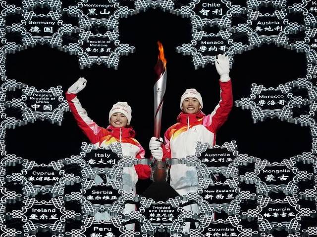 2022 Beijing Olympics Torchbearers - Torchbearers Zhao Jiawen and Dinigeer Yilamujiang hold the torch with the Olympic flame, during the opening ceremony of the Winter Olympic Games 2022 at the National Stadium in Beijing, China. <br />
Dinigeer Yilamujiang is a 20-year-old cross-country skier, born in Altai in the western Xinjiang region, from a Uyghur Muslim minority. Zhao Jiawen, a 21-year-old who competes in Nordic combined, finished the torch relay whose final runners were Chinese Olympians from recent decades. - , 2022, Beijing, Olympics, torchbearers, torchbearer, show, shows, sport, spots, Zhao, Jiawen, Dinigeer, Yilamujiang, torch, Olympic, flame, flames, ceremony, ceremonies, winter, Olympic, games, game, 2022, National, stadium, stadiums, Beijing, China, skier, Altai, western, Xinjiang, region, regions, Uyghur, Muslim, minority, Nordic, runners, Chinese - Torchbearers Zhao Jiawen and Dinigeer Yilamujiang hold the torch with the Olympic flame, during the opening ceremony of the Winter Olympic Games 2022 at the National Stadium in Beijing, China. <br />
Dinigeer Yilamujiang is a 20-year-old cross-country skier, born in Altai in the western Xinjiang region, from a Uyghur Muslim minority. Zhao Jiawen, a 21-year-old who competes in Nordic combined, finished the torch relay whose final runners were Chinese Olympians from recent decades. Solve free online 2022 Beijing Olympics Torchbearers puzzle games or send 2022 Beijing Olympics Torchbearers puzzle game greeting ecards  from puzzles-games.eu.. 2022 Beijing Olympics Torchbearers puzzle, puzzles, puzzles games, puzzles-games.eu, puzzle games, online puzzle games, free puzzle games, free online puzzle games, 2022 Beijing Olympics Torchbearers free puzzle game, 2022 Beijing Olympics Torchbearers online puzzle game, jigsaw puzzles, 2022 Beijing Olympics Torchbearers jigsaw puzzle, jigsaw puzzle games, jigsaw puzzles games, 2022 Beijing Olympics Torchbearers puzzle game ecard, puzzles games ecards, 2022 Beijing Olympics Torchbearers puzzle game greeting ecard
