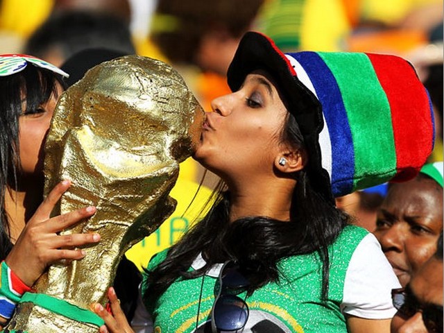 World Cup 2010 Replica of the Trophy - Fans kiss a replica of the World Cup trophy during the Opening ceremony of the 2010 FIFA World Cup tournament at Soccer City stadium in Johannesburg (May 11). - , World, Cup, 2010, replica, replicas, trophy, trophies, show, shows, performance, perormances, sport, sports, tournament, tournaments, qualification, qualifications, ceremony, ceremonies, math, matches, Opening, FIFA, Soccer, City, stadium, stadiums, Johannesburg - Fans kiss a replica of the World Cup trophy during the Opening ceremony of the 2010 FIFA World Cup tournament at Soccer City stadium in Johannesburg (May 11). Solve free online World Cup 2010 Replica of the Trophy puzzle games or send World Cup 2010 Replica of the Trophy puzzle game greeting ecards  from puzzles-games.eu.. World Cup 2010 Replica of the Trophy puzzle, puzzles, puzzles games, puzzles-games.eu, puzzle games, online puzzle games, free puzzle games, free online puzzle games, World Cup 2010 Replica of the Trophy free puzzle game, World Cup 2010 Replica of the Trophy online puzzle game, jigsaw puzzles, World Cup 2010 Replica of the Trophy jigsaw puzzle, jigsaw puzzle games, jigsaw puzzles games, World Cup 2010 Replica of the Trophy puzzle game ecard, puzzles games ecards, World Cup 2010 Replica of the Trophy puzzle game greeting ecard