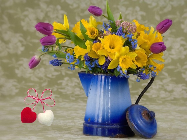 Spring Flowers and Martenitsa Wallpaper - Wallpaper with daffodils and tulips arranged in an old milk-jug, as a bouquet of spring flowers, decorated with martenitsa in shape of hearts. Martenitsa in Bulgaria is a herald of the coming spring. The red and white woven threads put together, symbolize rebirth, a change of the seasons, new life and a new beginning, the wish for good health, purity and strength. The ancient custom reminds people about the cycle of the life and death, the balance of good and evil, of the sorrow and happiness in human life. - , spring, flowers, flower, martenitsa, martenitsas, wallpaper, wallpapers, holidays, holiday, season, seasons, daffodils, daffodil, tulips, tulip, milk, jug, jugs, bouquet, bouquets, shape, shapes, hearts, heart, Bulgaria, herald, heralds, red, white, woven, threads, thread, rebirth, life, lives, beginning, wish, wishes, health, purity, strength, ancient, custom, customs, people, cycle, cycles, death, balance, good, evil, sorrow, happiness, human - Wallpaper with daffodils and tulips arranged in an old milk-jug, as a bouquet of spring flowers, decorated with martenitsa in shape of hearts. Martenitsa in Bulgaria is a herald of the coming spring. The red and white woven threads put together, symbolize rebirth, a change of the seasons, new life and a new beginning, the wish for good health, purity and strength. The ancient custom reminds people about the cycle of the life and death, the balance of good and evil, of the sorrow and happiness in human life. Solve free online Spring Flowers and Martenitsa Wallpaper puzzle games or send Spring Flowers and Martenitsa Wallpaper puzzle game greeting ecards  from puzzles-games.eu.. Spring Flowers and Martenitsa Wallpaper puzzle, puzzles, puzzles games, puzzles-games.eu, puzzle games, online puzzle games, free puzzle games, free online puzzle games, Spring Flowers and Martenitsa Wallpaper free puzzle game, Spring Flowers and Martenitsa Wallpaper online puzzle game, jigsaw puzzles, Spring Flowers and Martenitsa Wallpaper jigsaw puzzle, jigsaw puzzle games, jigsaw puzzles games, Spring Flowers and Martenitsa Wallpaper puzzle game ecard, puzzles games ecards, Spring Flowers and Martenitsa Wallpaper puzzle game greeting ecard