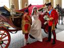 Royal Wedding England Prince William helps Catherine to get down from the Carriage at Buckingham Palace in London